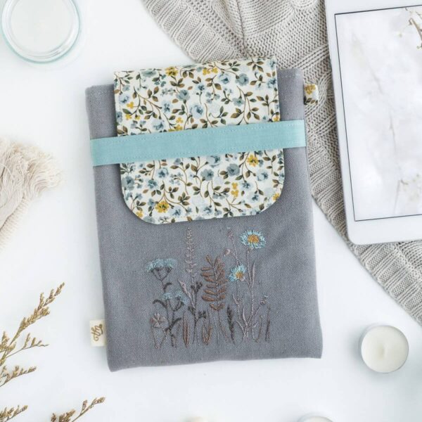 Padded mini tablet sleeve with teal meadow flowers
