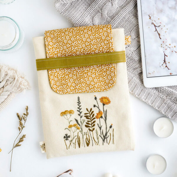Padded mini tablet sleeve with yellow meadow flowers